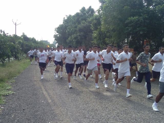 Students running on the campus track